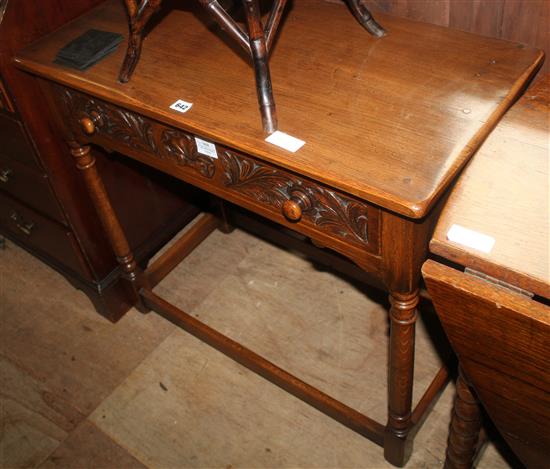 Oak side table, fitted one long carved drawer